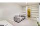 Bright room features comfortable seating and hidden door leading to additional storage at 260 Cicely Way, Tyrone, GA 30290
