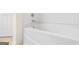 Close-up of a bathtub and shower controls in a bathroom at 6533 Waterford Sw St, Atlanta, GA 30331