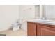 Bathroom featuring a vanity and toilet with good natural light at 6533 Waterford Sw St, Atlanta, GA 30331