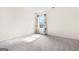 Cozy bedroom showcasing a window with patterned curtains and soft gray carpet at 6533 Waterford Sw St, Atlanta, GA 30331