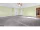 This expansive carpeted bedroom has a ceiling fan and double closets at 6533 Waterford Sw St, Atlanta, GA 30331