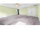 Bright bedroom with carpet, tray ceilings, and natural light from the window at 6533 Waterford Sw St, Atlanta, GA 30331