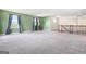 Bright bonus room with soft carpeting and large windows offering plenty of natural light at 6533 Waterford Sw St, Atlanta, GA 30331