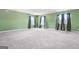 Expansive bonus room featuring plush carpeting, ample natural light, and a comfortable atmosphere at 6533 Waterford Sw St, Atlanta, GA 30331