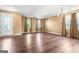 Inviting foyer bathed in natural light with dark hardwood floors, a chandelier and views of the front door at 6533 Waterford Sw St, Atlanta, GA 30331