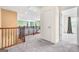 Hallway with carpeted floor, staircase, and open doorway at 6533 Waterford Sw St, Atlanta, GA 30331