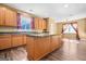 Open concept kitchen with modern island, ample wooden cabinetry, and modern stainless appliances at 6533 Waterford Sw St, Atlanta, GA 30331