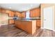 Spacious kitchen featuring a large island, wood cabinets, granite countertops, and stainless steel appliances at 6533 Waterford Sw St, Atlanta, GA 30331