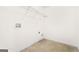 Small laundry room with tile flooring, utility hookups, and wire shelving at 6533 Waterford Sw St, Atlanta, GA 30331