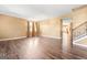 Open-concept living room with dark hardwood floors and plenty of natural light at 6533 Waterford Sw St, Atlanta, GA 30331