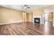 Spacious living room with hardwood floors, a fireplace, and neutral paint at 6533 Waterford Sw St, Atlanta, GA 30331