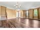 Large living room with hardwood floors, a chandelier, and lots of light at 6533 Waterford Sw St, Atlanta, GA 30331