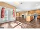 Open floorplan showcasing hardwood floors, fireplace, and easy access to a modern kitchen space at 6533 Waterford Sw St, Atlanta, GA 30331