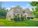 This beautiful home boasts a well-maintained lawn, mature landscaping, and a classic architectural design at 6533 Waterford Sw St, Atlanta, GA 30331