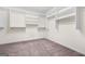 Walk-in closet with built-in shelving and ample storage space at 6533 Waterford Sw St, Atlanta, GA 30331