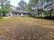Backyard view featuring a fenced yard and a back patio at 578 Lakeridge Se Cir, Conyers, GA 30094