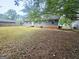 Backyard view featuring a fenced yard and mature trees at 578 Lakeridge Se Cir, Conyers, GA 30094