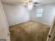Cozy bedroom with ceiling fan and ample natural light at 578 Lakeridge Se Cir, Conyers, GA 30094