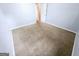Bedroom featuring neutral carpet, light blue walls, and a white door at 578 Lakeridge Se Cir, Conyers, GA 30094