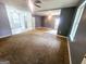 Spacious living room with plush carpeting and abundant natural light at 578 Lakeridge Se Cir, Conyers, GA 30094