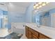 Inviting bathroom with a soaking tub, double vanity, and soothing blue wall art and accents at 510 Jenna Trl, Mcdonough, GA 30252