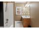 Bathroom features a shower-tub combo with neutral walls, single vanity, and ample lighting at 510 Jenna Trl, Mcdonough, GA 30252