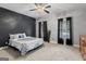 Well-lit bedroom showcasing a decorative accent wall and plush carpeting at 510 Jenna Trl, Mcdonough, GA 30252