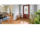 Welcoming foyer showcasing hardwood floors, complemented by a decorative front door and adjacent dining area at 510 Jenna Trl, Mcdonough, GA 30252