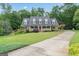 Beautiful home boasting a well-manicured lawn, complemented by vibrant landscaping and a lengthy driveway at 510 Jenna Trl, Mcdonough, GA 30252