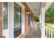Inviting front porch with rocking chairs, providing a perfect spot to unwind and enjoy the outdoors at 510 Jenna Trl, Mcdonough, GA 30252