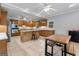 Spacious kitchen with oak cabinets, island with seating, stainless steel appliances, and adjacent dining area at 510 Jenna Trl, Mcdonough, GA 30252