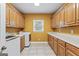 Functional laundry room with ample cabinetry, counter space, and a convenient utility sink at 510 Jenna Trl, Mcdonough, GA 30252