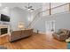 Open living room featuring high ceilings, fireplace, hardwood floors, staircase and comfortable seating at 510 Jenna Trl, Mcdonough, GA 30252