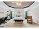 Large main bedroom featuring tray ceiling, decorative details, and sitting area at 510 Jenna Trl, Mcdonough, GA 30252