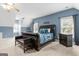 Spacious main bedroom features a large bed, sitting area, and ample natural light from multiple windows at 510 Jenna Trl, Mcdonough, GA 30252