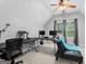 Functional office space with multiple workstations, comfortable seating, and bright natural light at 510 Jenna Trl, Mcdonough, GA 30252