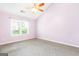 Bright bedroom featuring a vaulted ceiling, ceiling fan, and natural light from the window at 2340 Landrum Ct, Lawrenceville, GA 30043