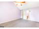 Bedroom with a vaulted ceiling, ceiling fan, and ensuite bathroom access at 2340 Landrum Ct, Lawrenceville, GA 30043