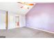 Spacious bedroom with a ceiling fan, neutral carpet, and ensuite bathroom access at 2340 Landrum Ct, Lawrenceville, GA 30043