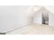 Upstairs attic bedroom featuring light paint and carpet at 2340 Landrum Ct, Lawrenceville, GA 30043