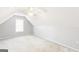 Upstairs attic bedroom featuring light paint and carpeting at 2340 Landrum Ct, Lawrenceville, GA 30043