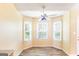 Charming breakfast nook bathed in natural light from three windows with modern flooring at 2340 Landrum Ct, Lawrenceville, GA 30043