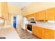 Bright kitchen with light wood cabinets, white appliances, and a neutral countertop offers functionality and style at 2340 Landrum Ct, Lawrenceville, GA 30043