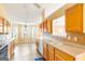 Open kitchen features countertops, white appliances and a view of the breakfast nook at 2340 Landrum Ct, Lawrenceville, GA 30043