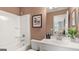 Modern bathroom with a shower/tub combo, vanity, and neutral color scheme at 1739 Goodwin, Hampton, GA 30228