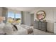 Well-lit bedroom featuring a large window with outside views and stylish décor at 1739 Goodwin, Hampton, GA 30228