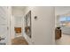 Bright hallway with hardwood floors, large mirrors, and neutral walls at 1739 Goodwin, Hampton, GA 30228