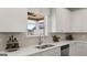 Bright kitchen with stainless steel sink, modern appliances and herringbone backsplash at 1739 Goodwin, Hampton, GA 30228