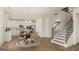 Bright living area connects seamlessly to the modern kitchen and open staircase at 1739 Goodwin, Hampton, GA 30228