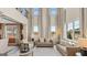 Bright and airy living room with soaring ceilings, large windows, and stylish furnishings, perfect for relaxation and entertaining at 1739 Goodwin, Hampton, GA 30228